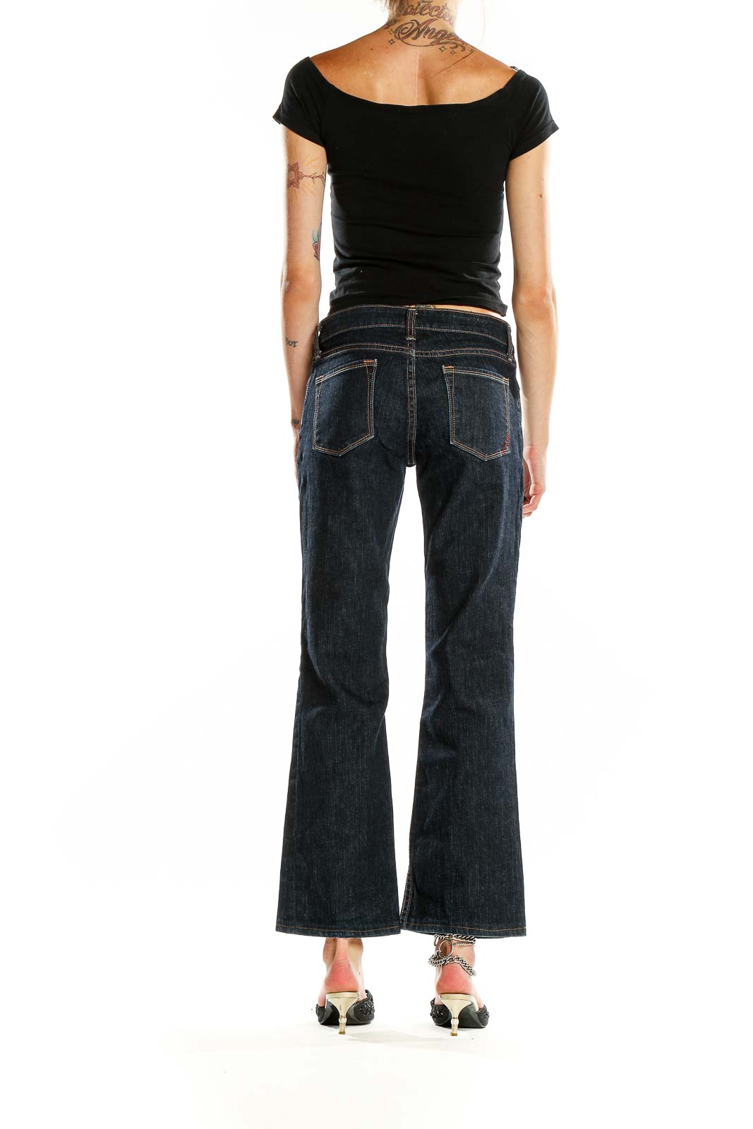 Back view of Banana Republic dark blue bootcut jeans on model