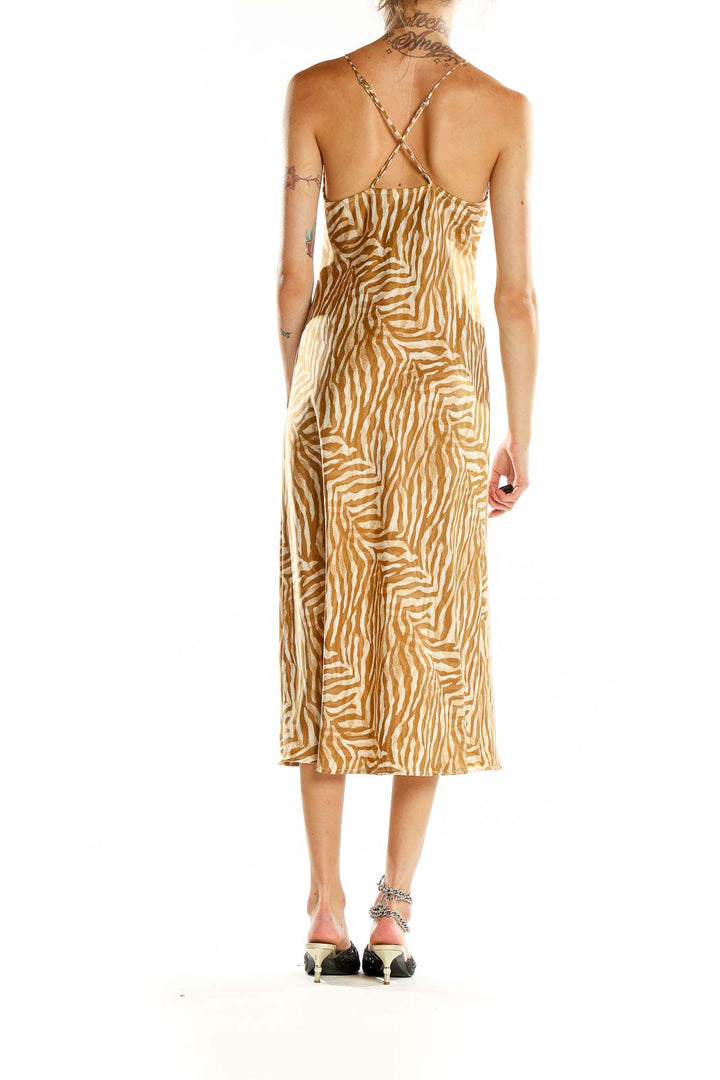 Back view of Banana Republic beige zebra print midi dress showing criss-cross straps