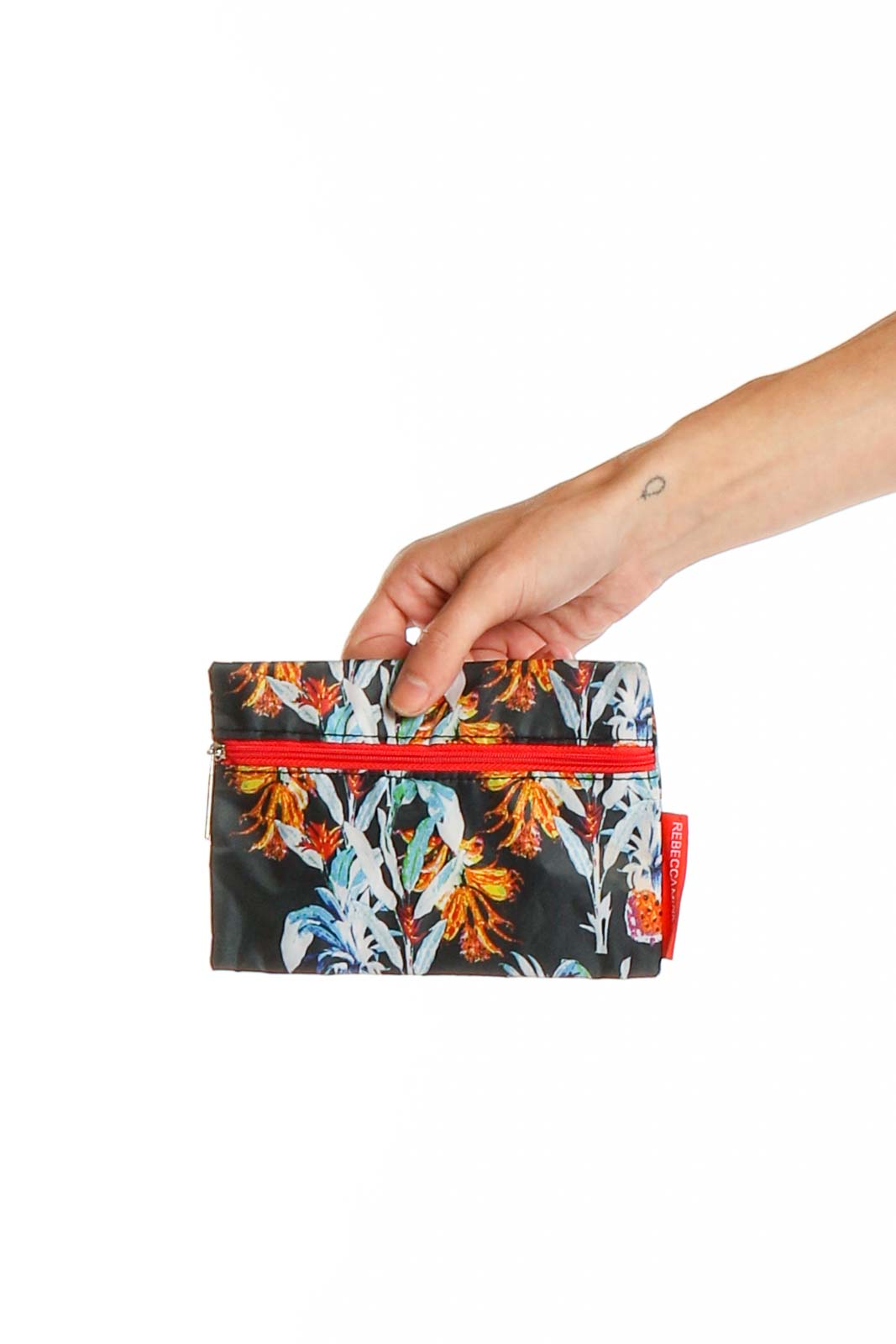 Front view of Rebecca Minkoff floral print clutch with red zipper