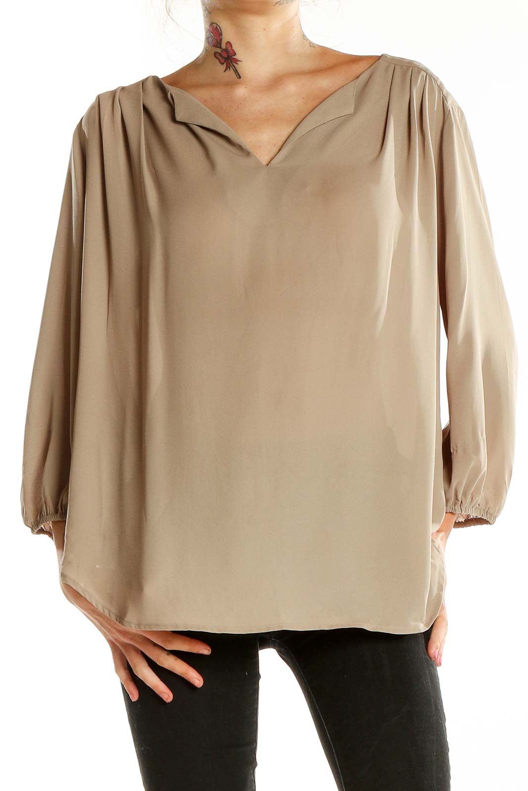 Front view of beige Pleione V-neck blouse with flowy sleeves