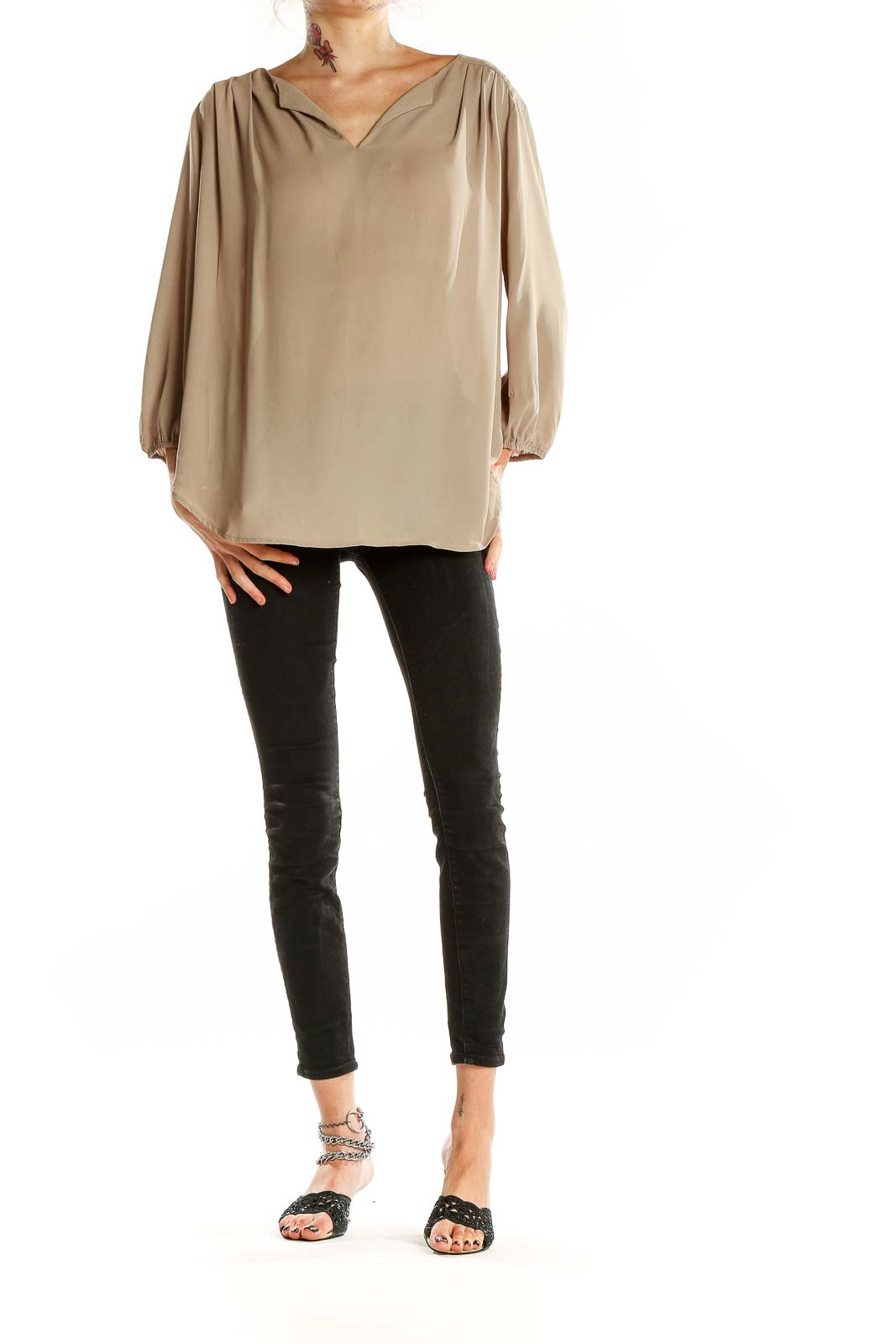 Front view of beige Pleione V-neck blouse with flowy sleeves