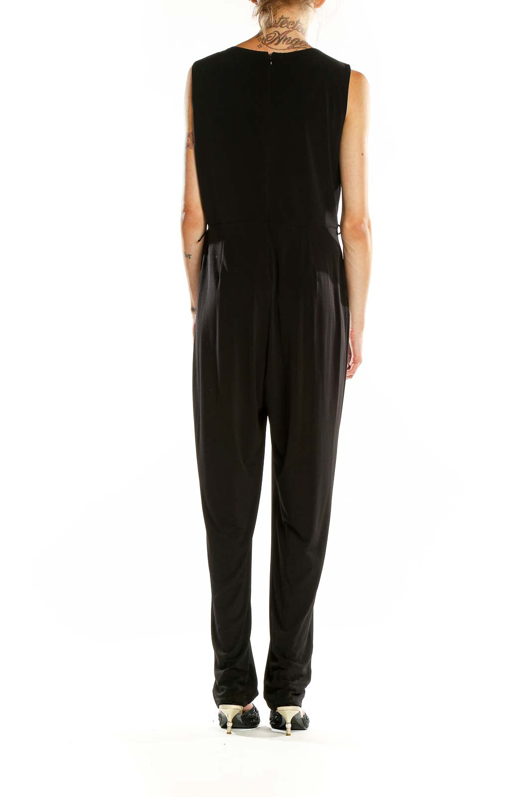 Back view of Calvin Klein black jumpsuit showing full-length design