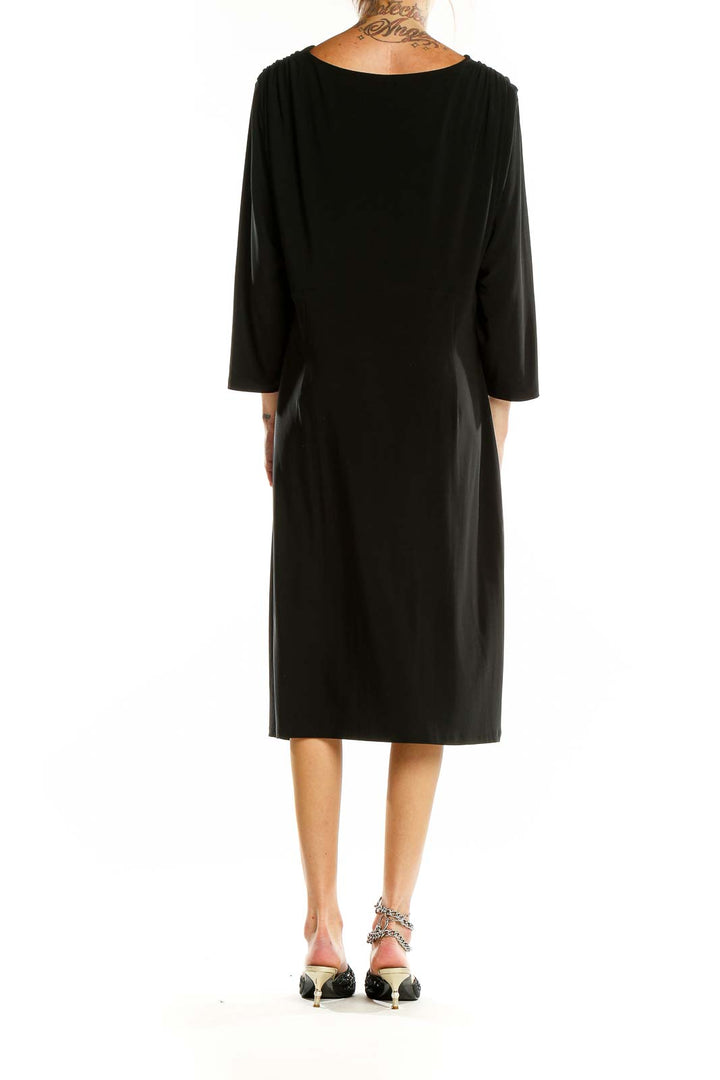 Back view of black Lauren Ralph Lauren midi dress showing elegant drape and length