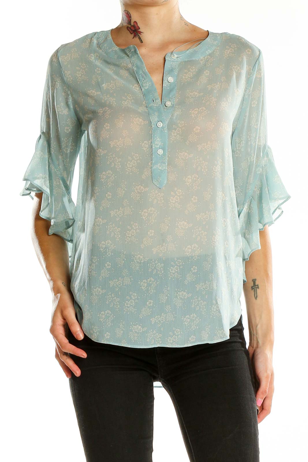 Front view of Vince Camuto mint floral sheer blouse with bell sleeves