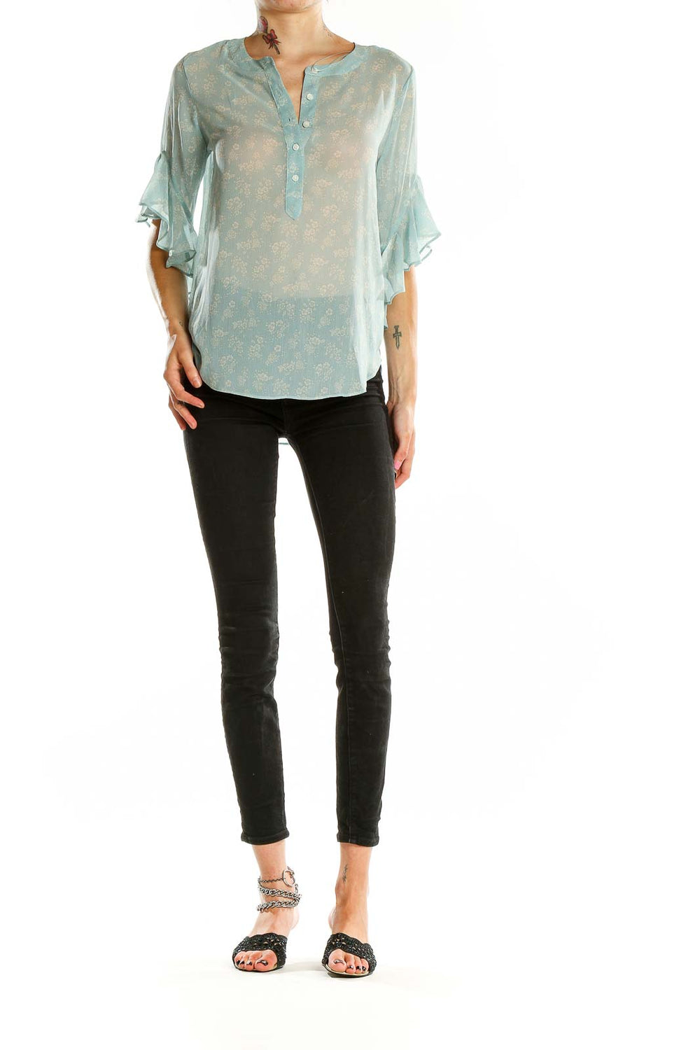 Front view of Vince Camuto mint floral sheer blouse with bell sleeves