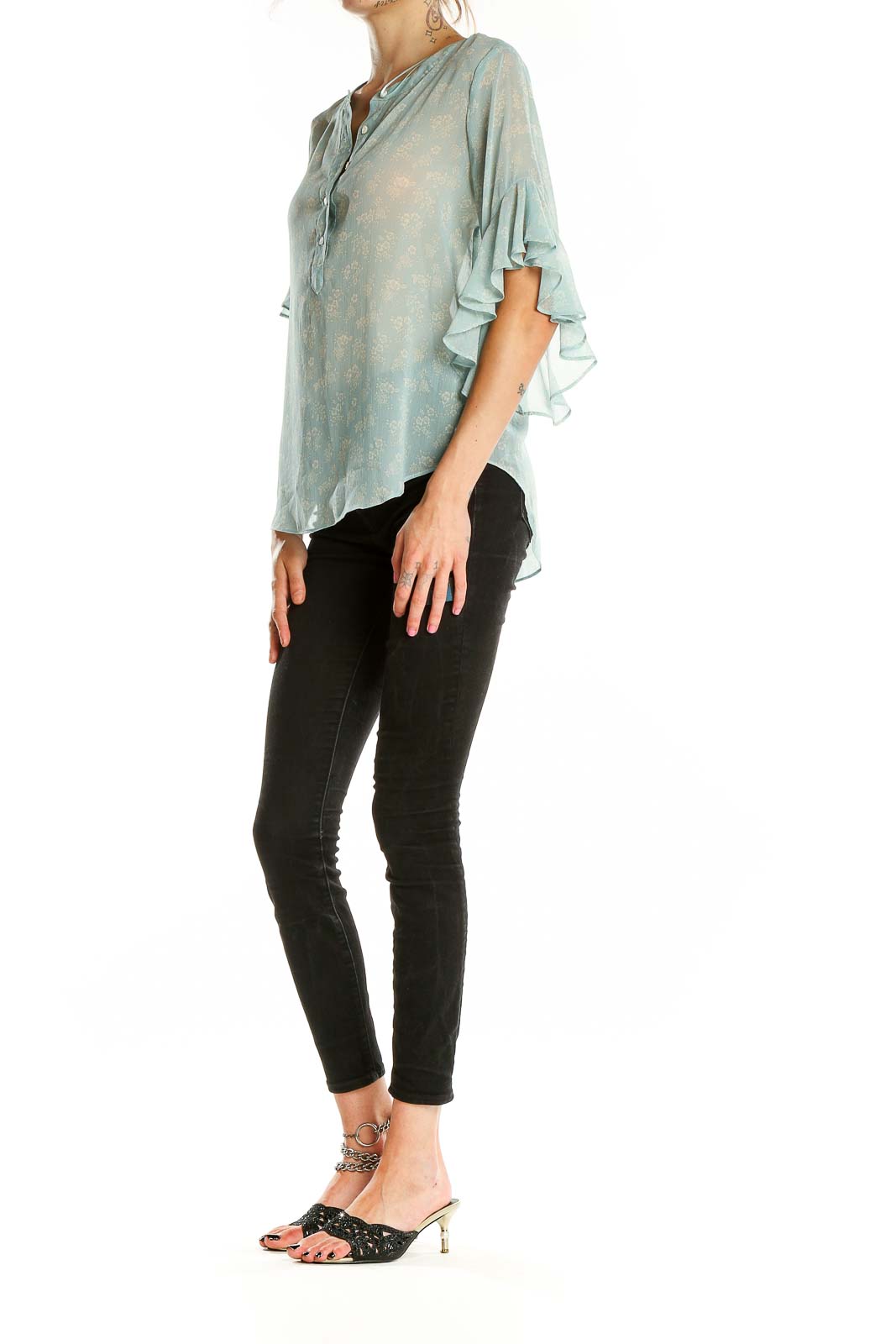 Front view of Vince Camuto mint floral sheer blouse with bell sleeves