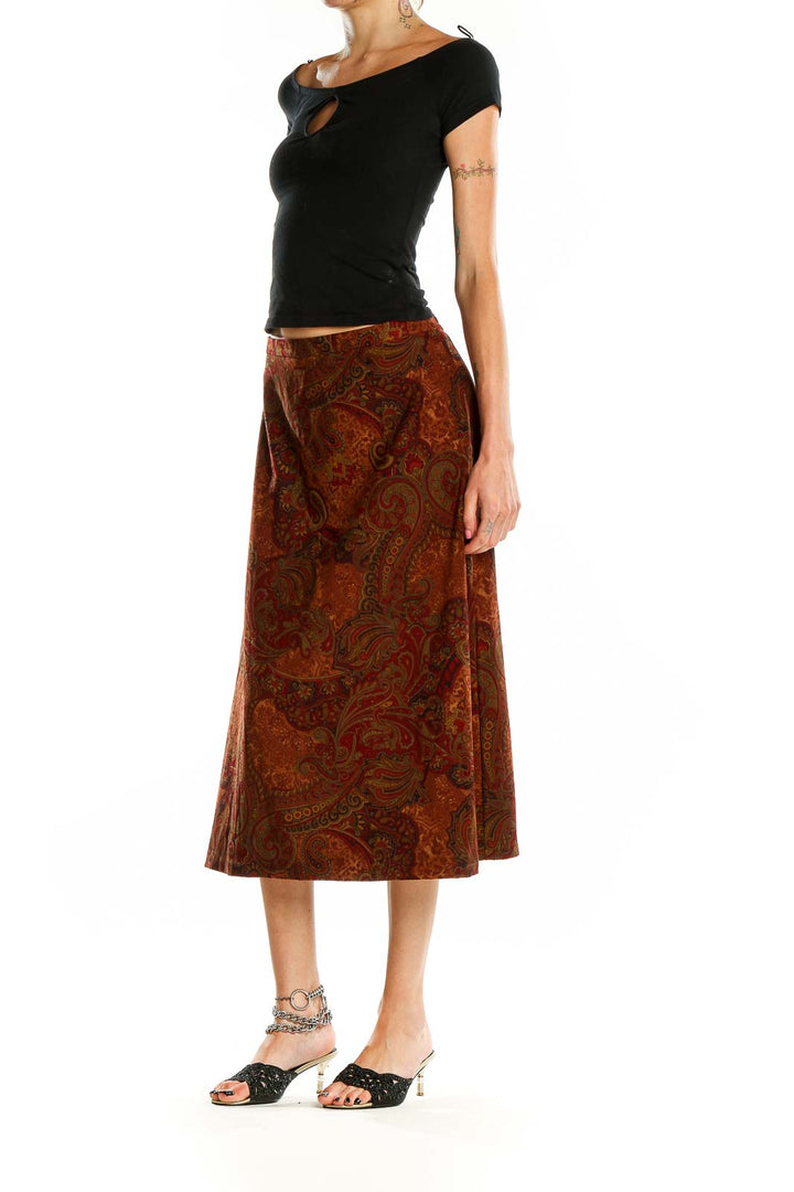 Front view of SilkRoll rust paisley midi skirt with A-line silhouette