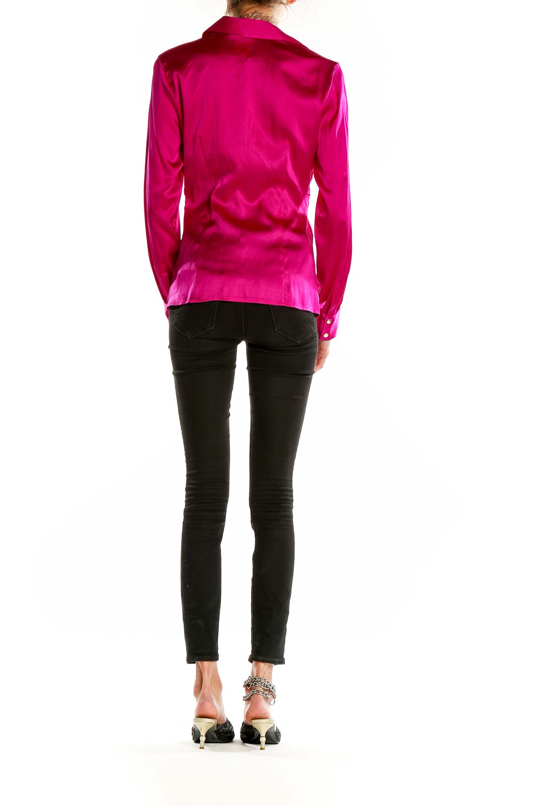 Back view of Cache fuchsia satin button-up blouse on model with black pants