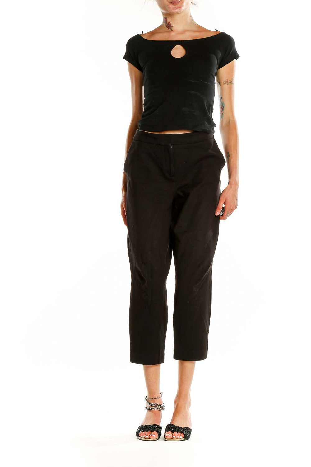 Front view of Boden black cropped tailored trousers on model