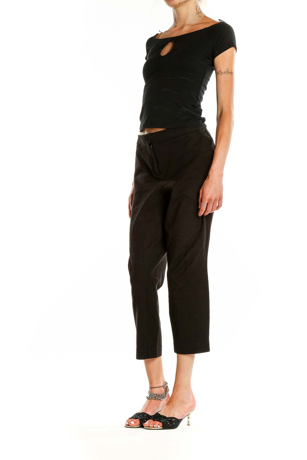 Front view of Boden black cropped tailored trousers on model