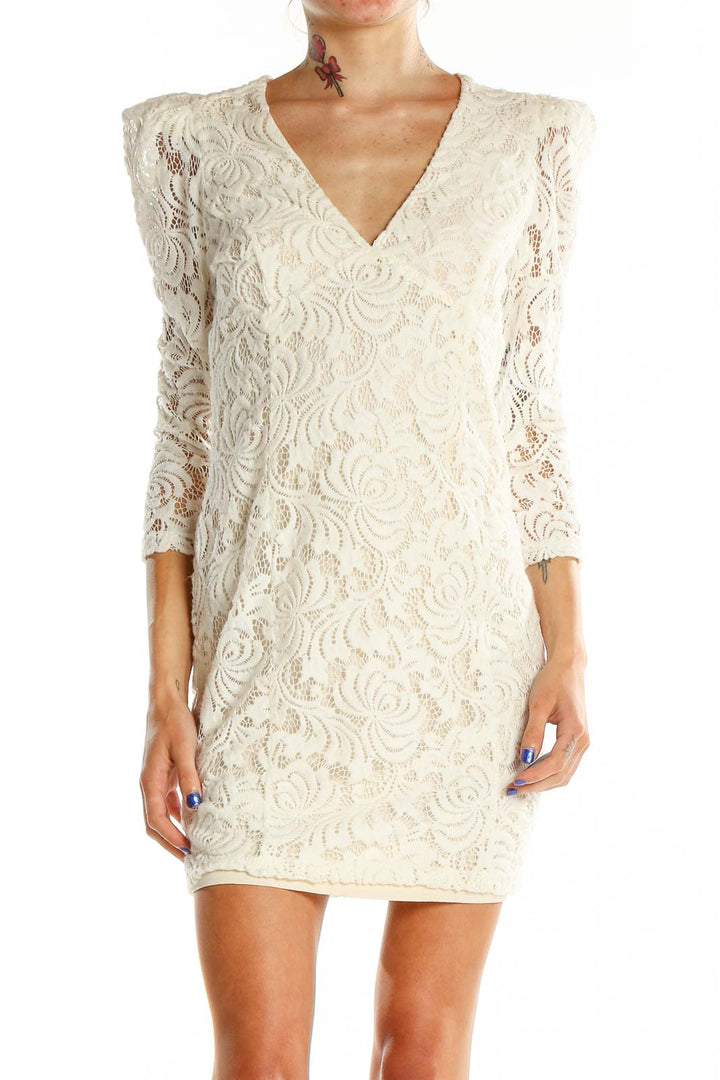 Front view of Free People ivory lace mini dress with V-neckline