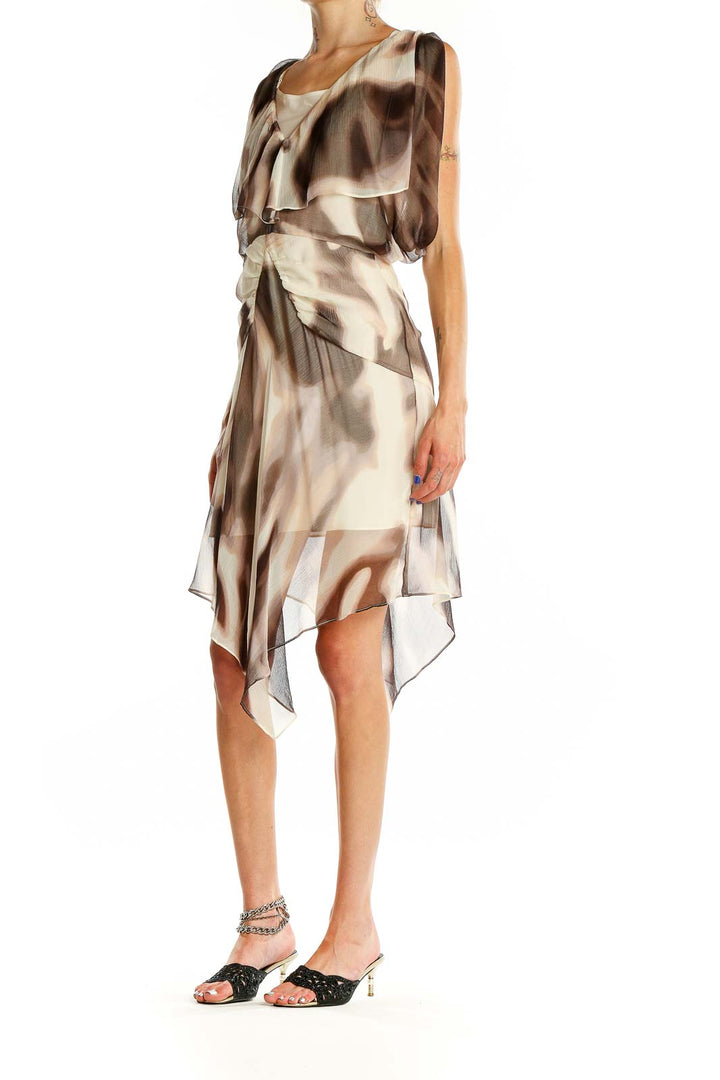 Front view of Moda International beige abstract print flowy dress with layered design