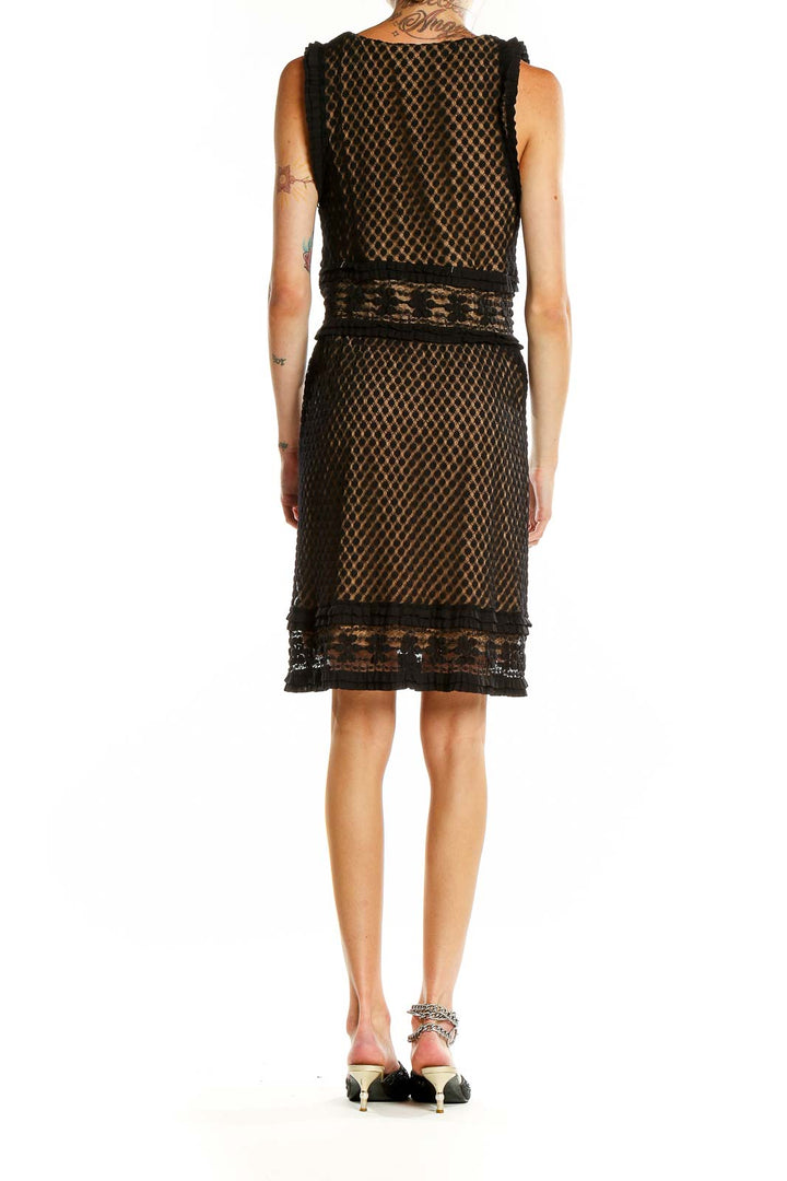 Back view of Max Studio black lace overlay cocktail dress showing full-length lace pattern