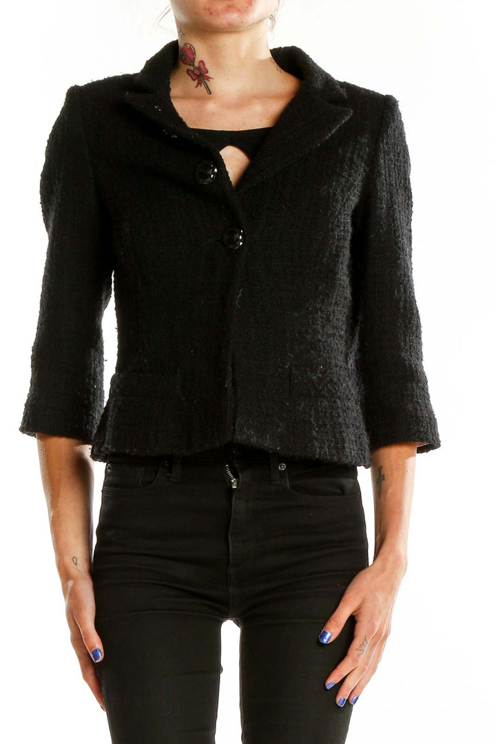 Front view of Milly black textured cropped blazer with three-button closure