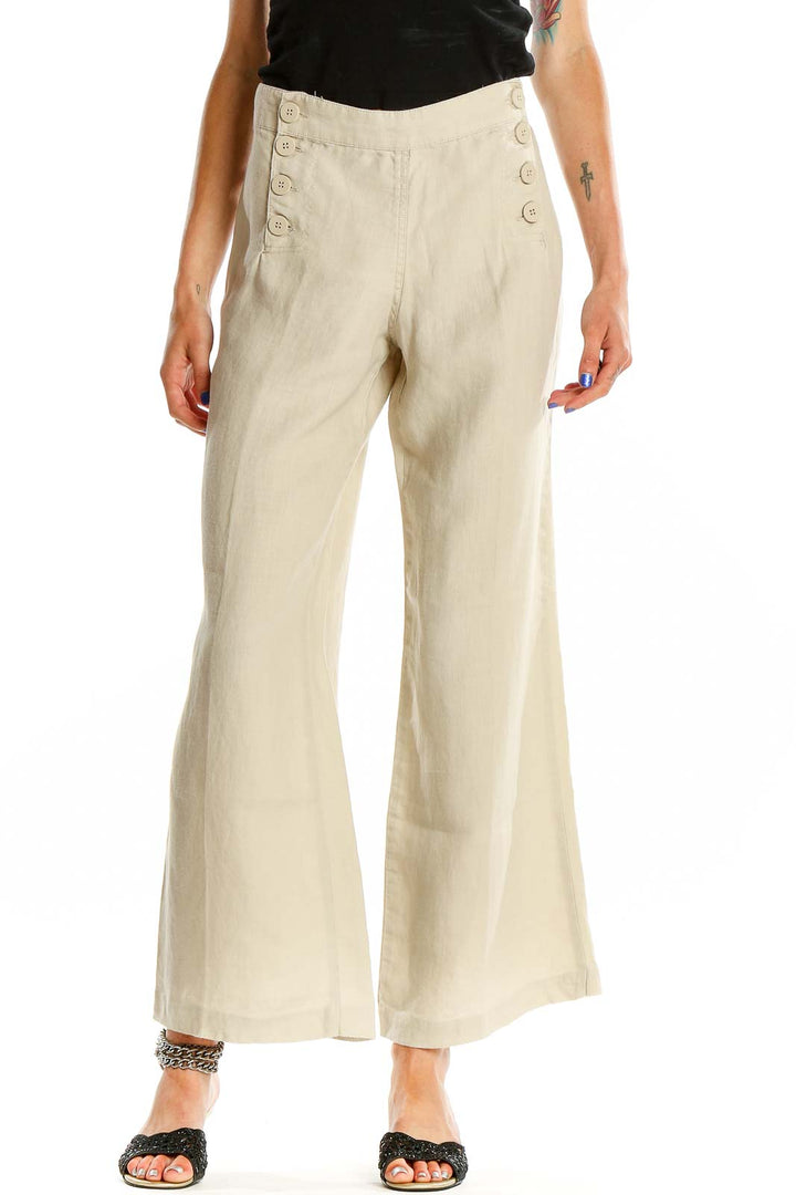 Front view of Max Studio beige linen wide-leg pants with sailor buttons