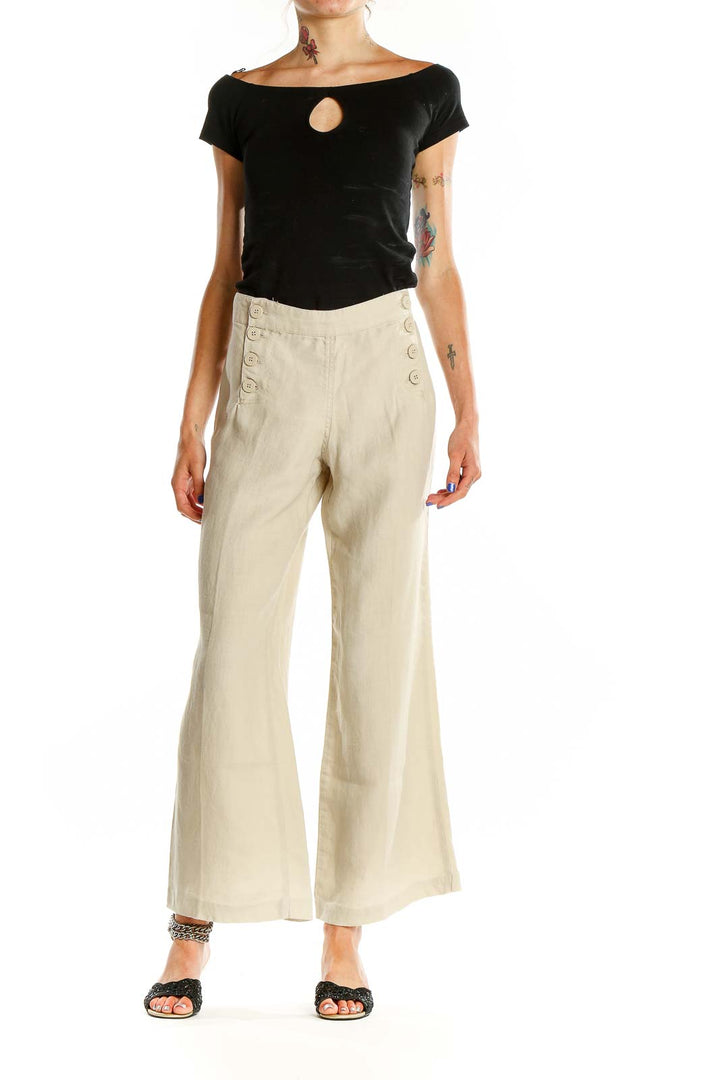 Front view of Max Studio beige linen wide-leg pants with sailor buttons