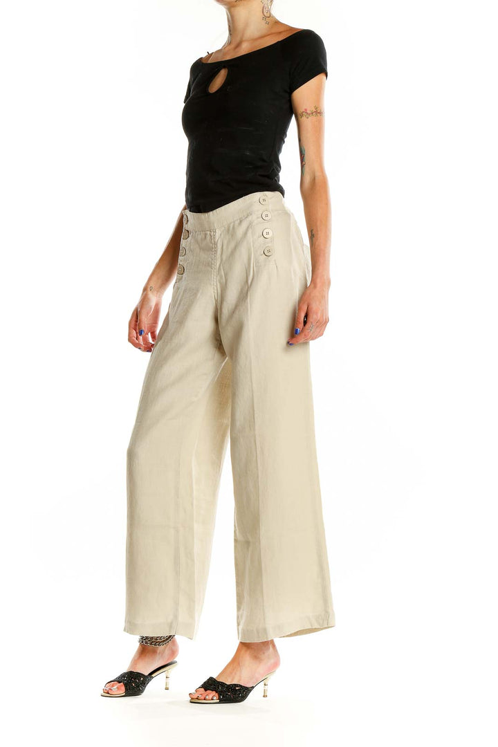 Front view of Max Studio beige linen wide-leg pants with sailor buttons