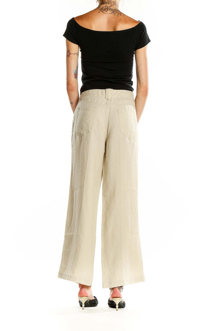 Back view of Max Studio beige linen wide-leg pants showing relaxed fit