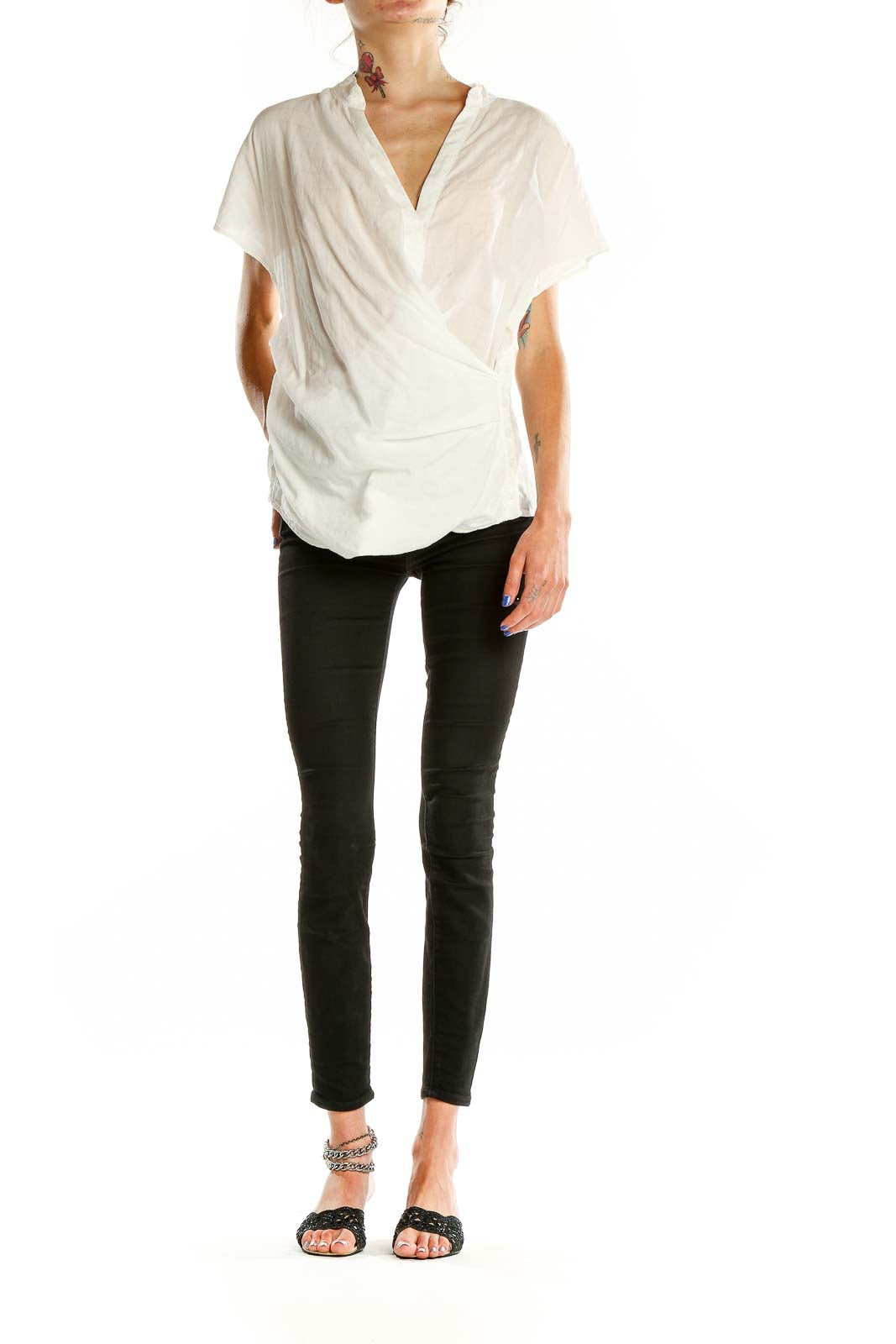 Front view of Akemi + Kin white wrap-style short sleeve blouse