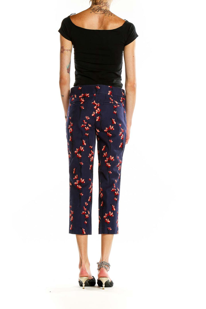 Back view of Ann Taylor LOFT Petites navy cropped pants with red floral print