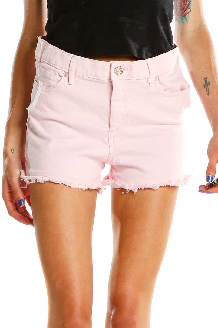 Front view of Lilly Pulitzer pink denim shorts with frayed hem