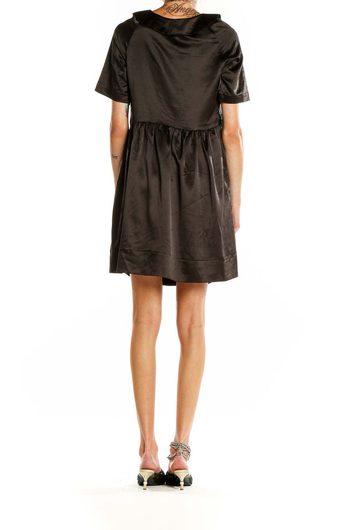 Back view of Marc By Marc Jacobs black satin dress showing gathered waist and full skirt