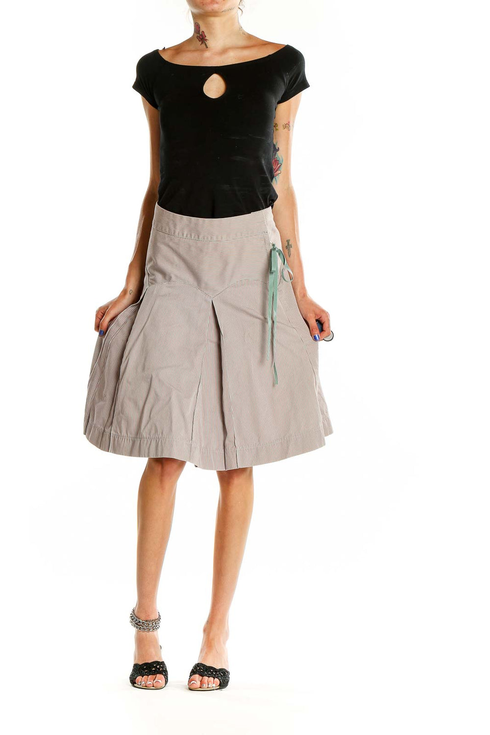 Front view of MARC JACOBS beige pleated A-line midi skirt with pinstripe pattern and mint ribbon detail