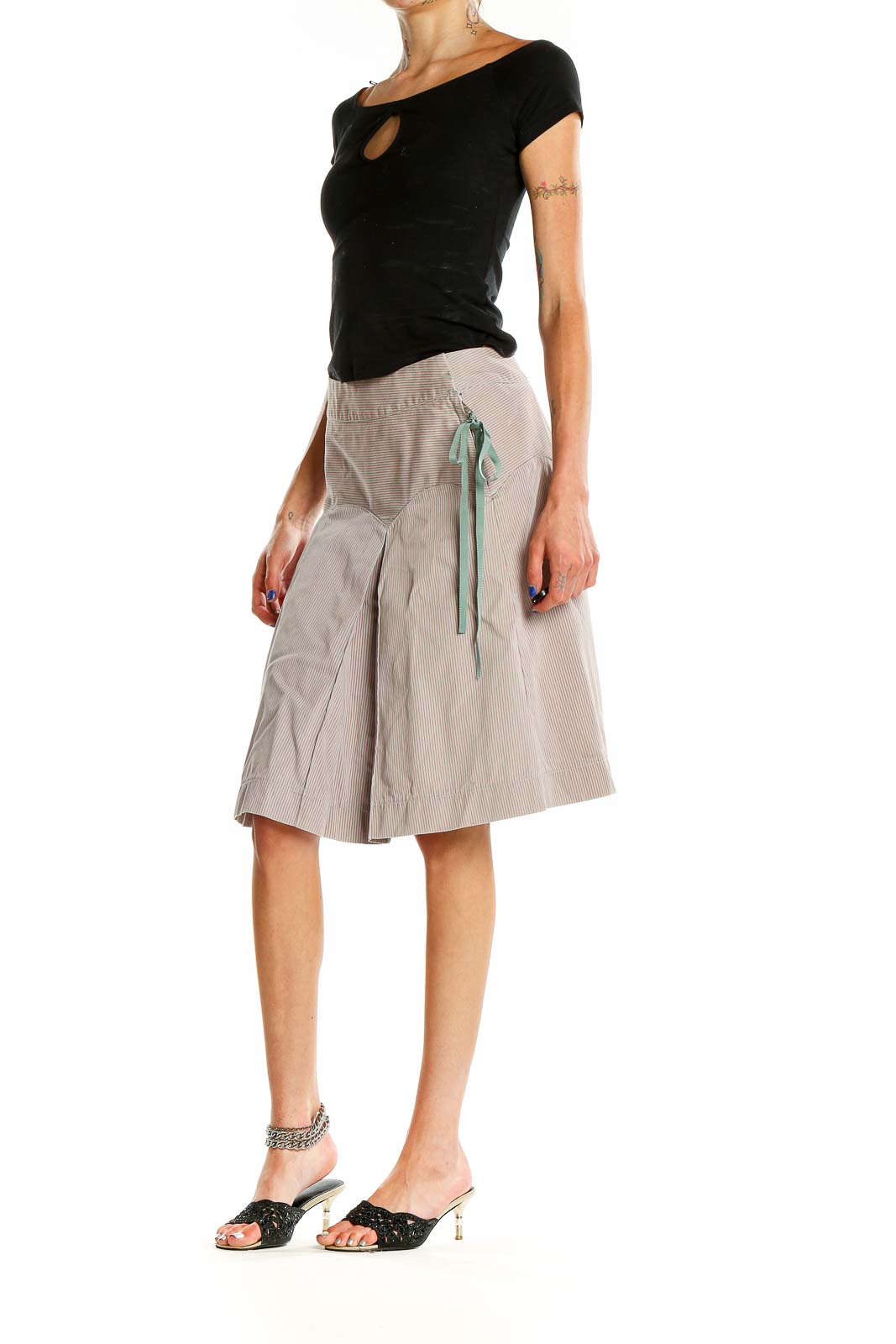 Front view of MARC JACOBS beige pleated A-line midi skirt with pinstripe pattern and mint ribbon detail