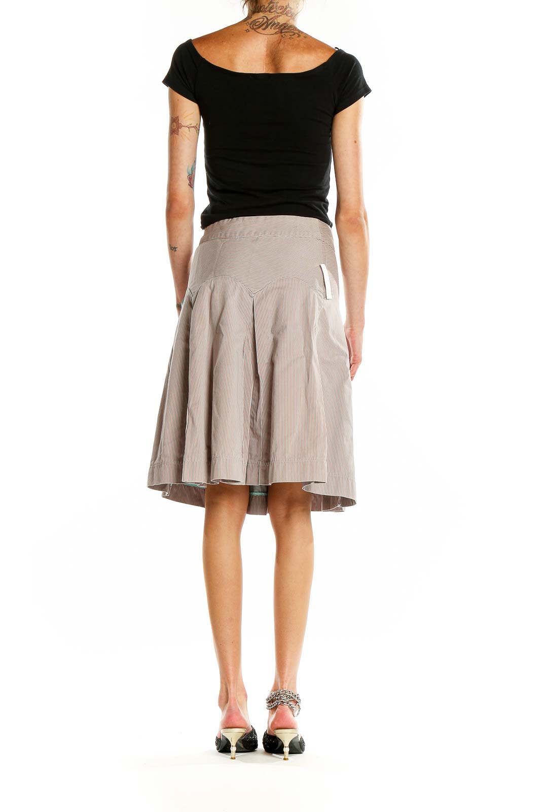 Back view of MARC JACOBS beige pleated A-line midi skirt showing full silhouette and pleating