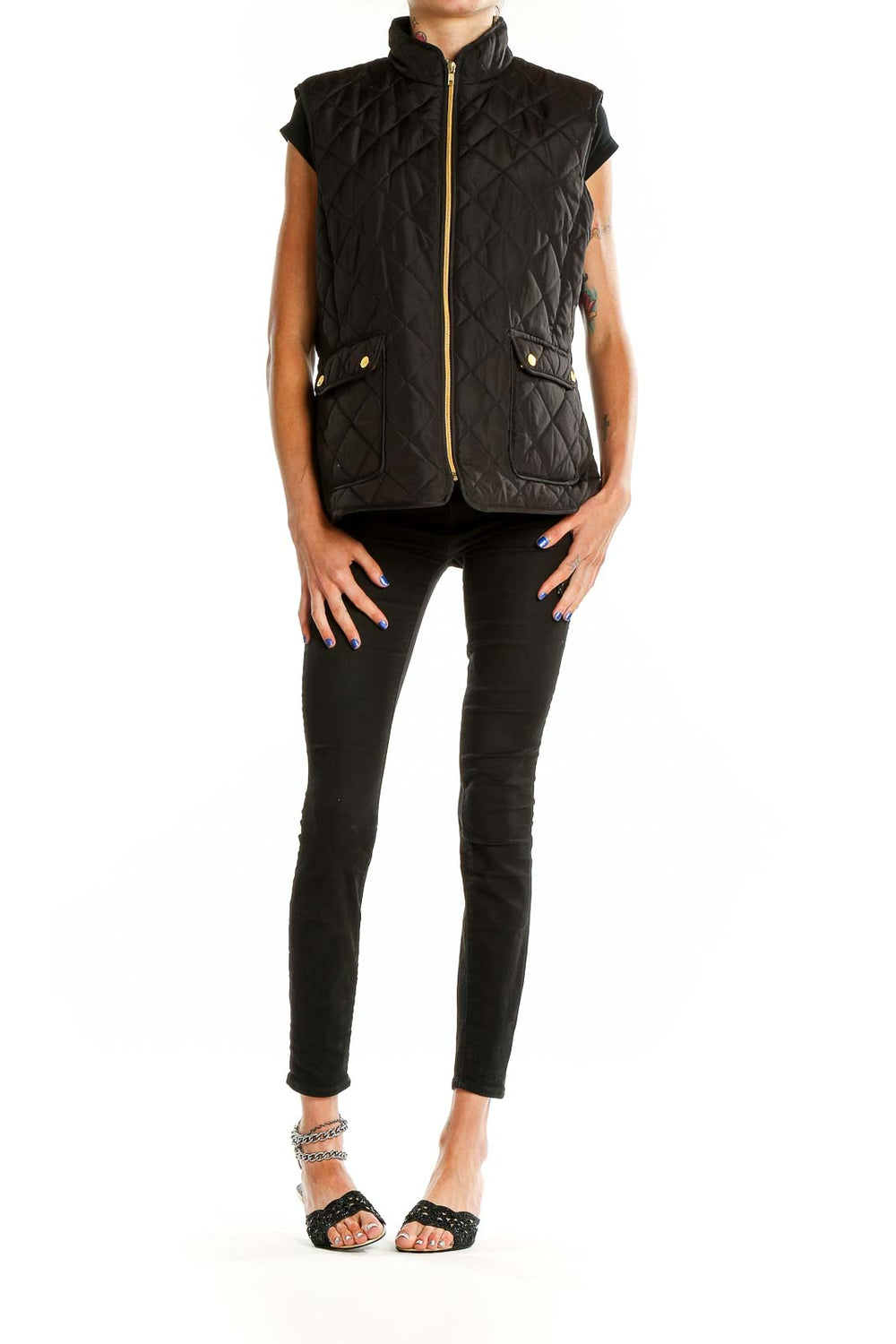 Front view of St. John's Bay black quilted vest with gold-tone zipper