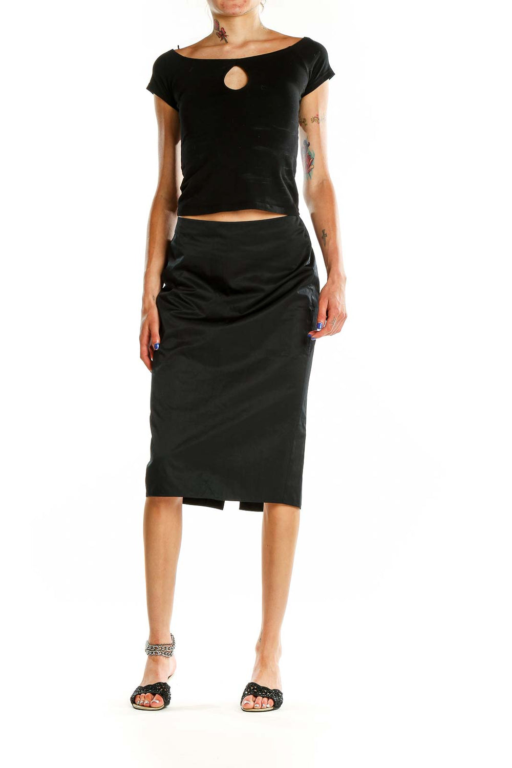 Front view of Calvin Klein black pencil midi skirt on model