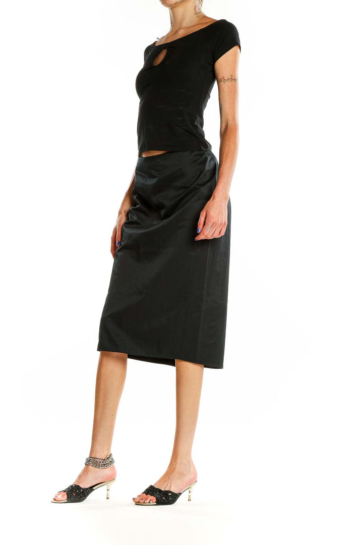 Front view of Calvin Klein black pencil midi skirt on model