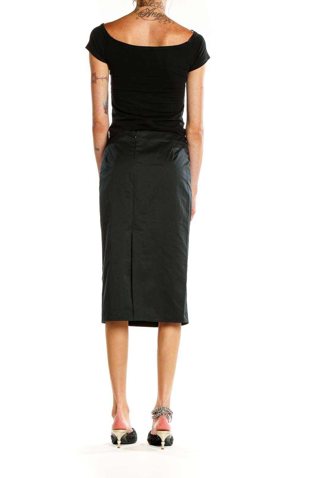 Back view of Calvin Klein black pencil midi skirt showing slit detail