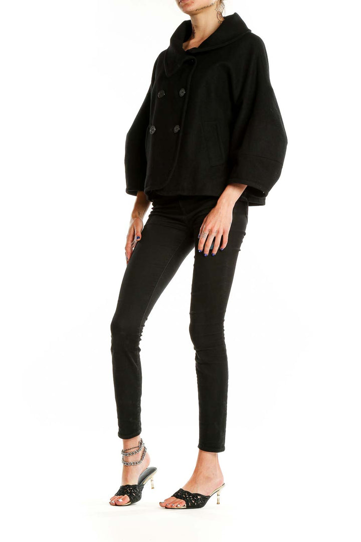 Front view of black double-breasted cropped jacket by Tex by MaxAzria