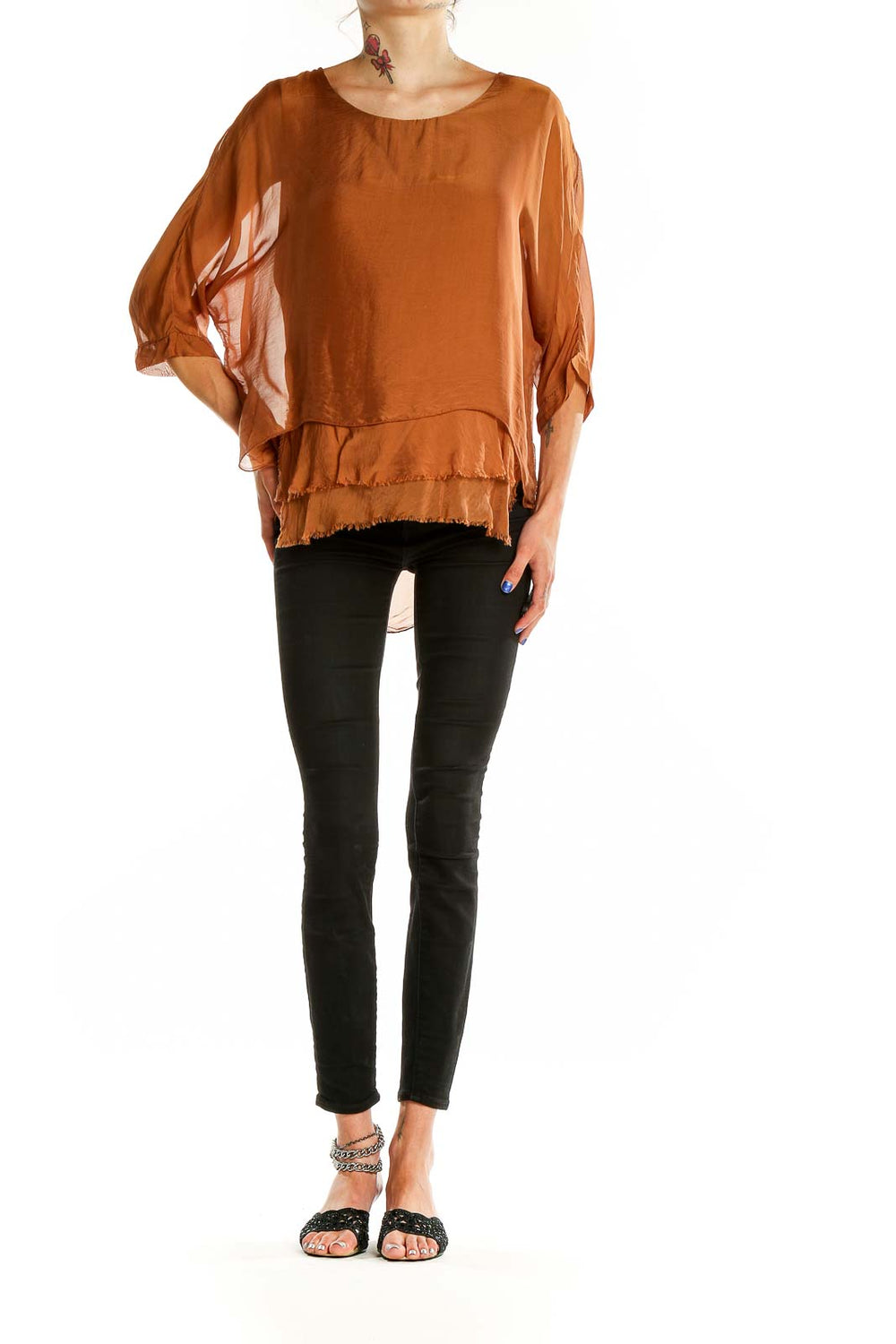 Front view of Gigi moda rust flowy layered blouse with billowing sleeves