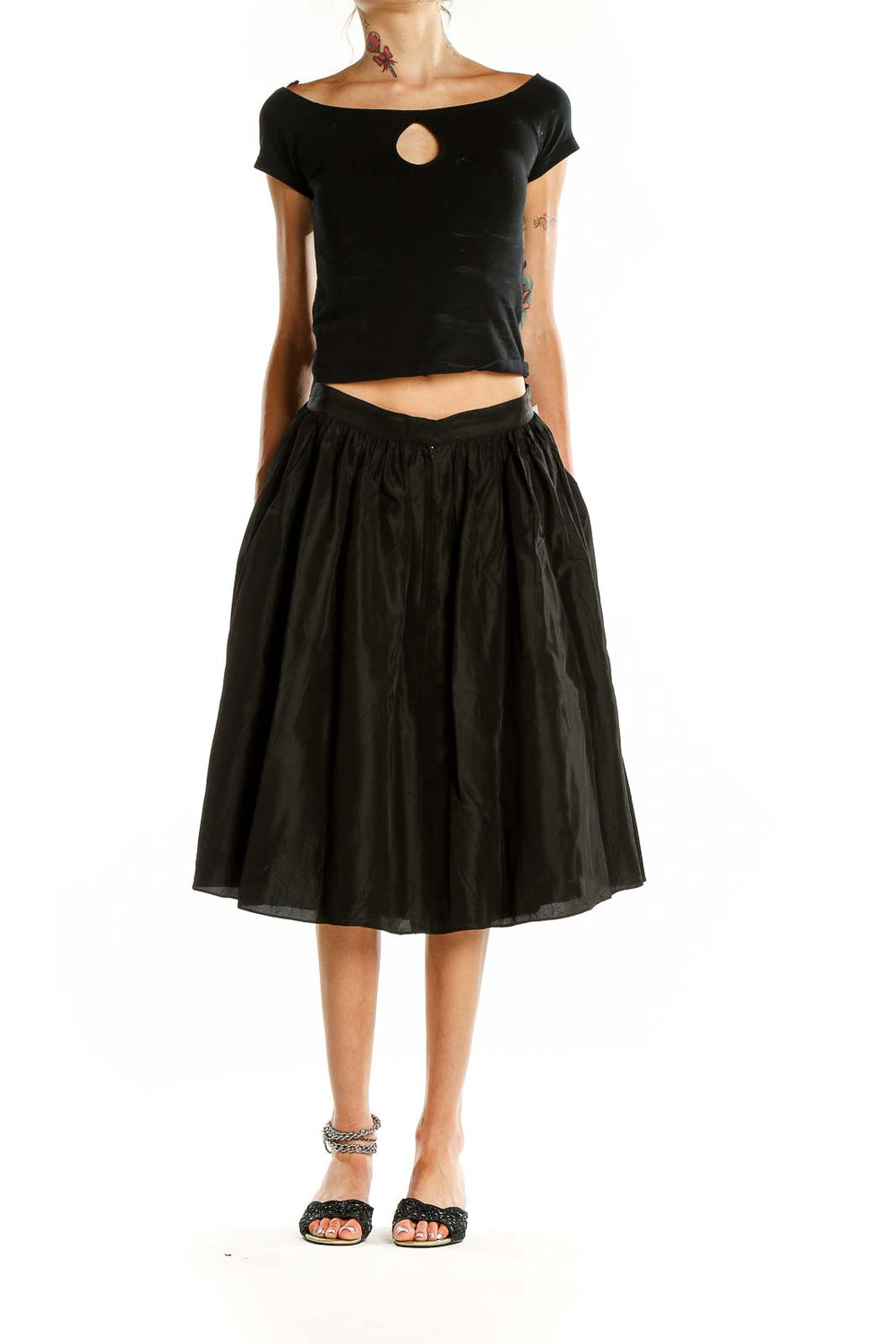 Front view of SilkRoll black flared midi skirt on model