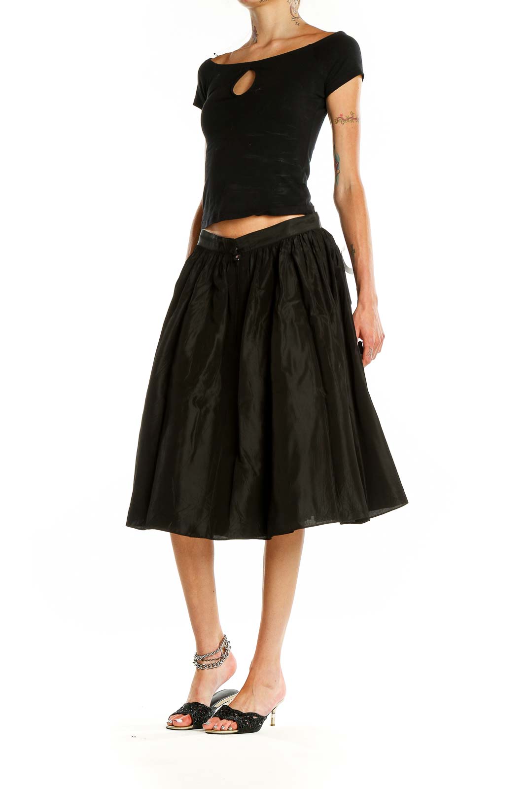 Front view of SilkRoll black flared midi skirt on model