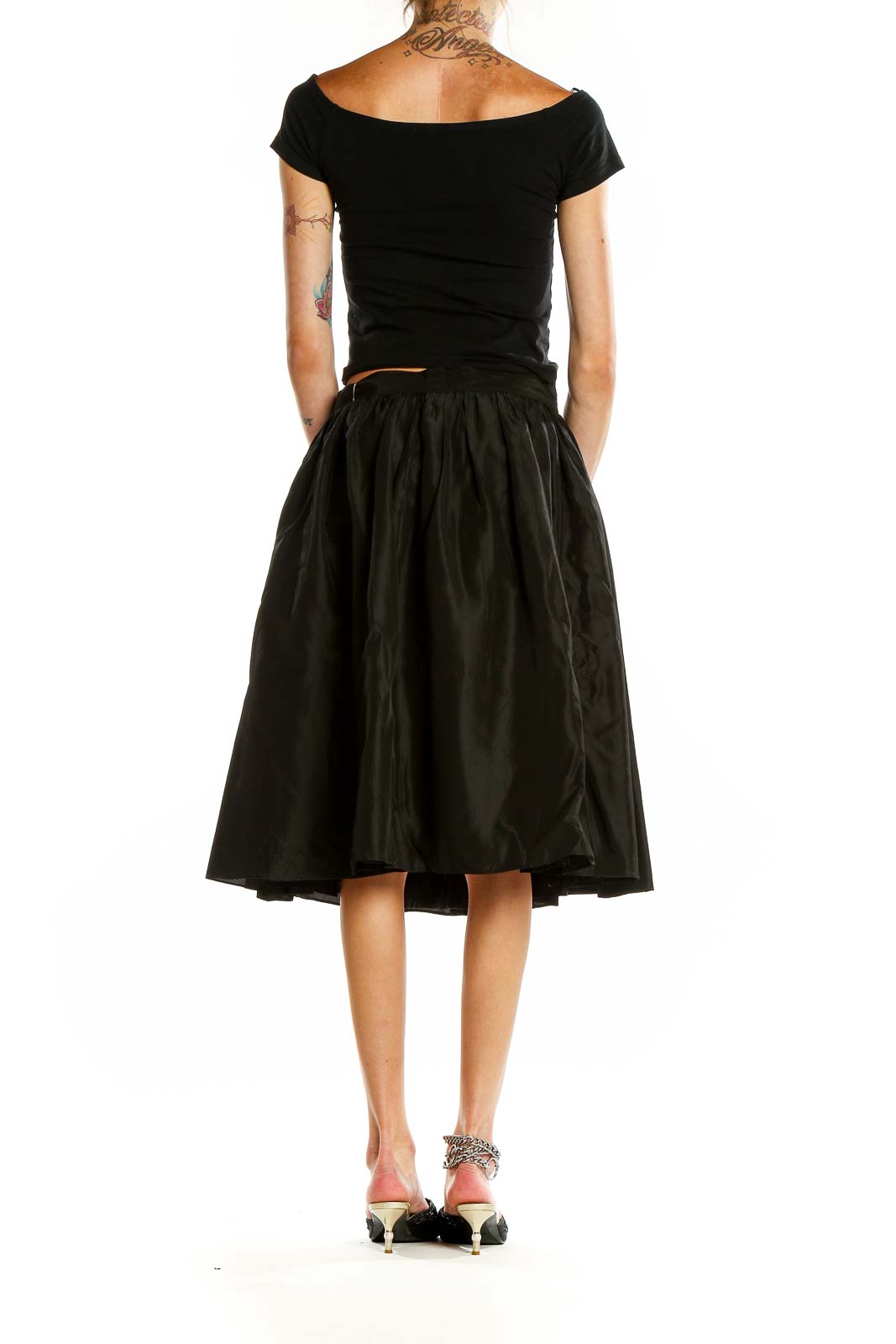 Back view of SilkRoll black flared midi skirt on model