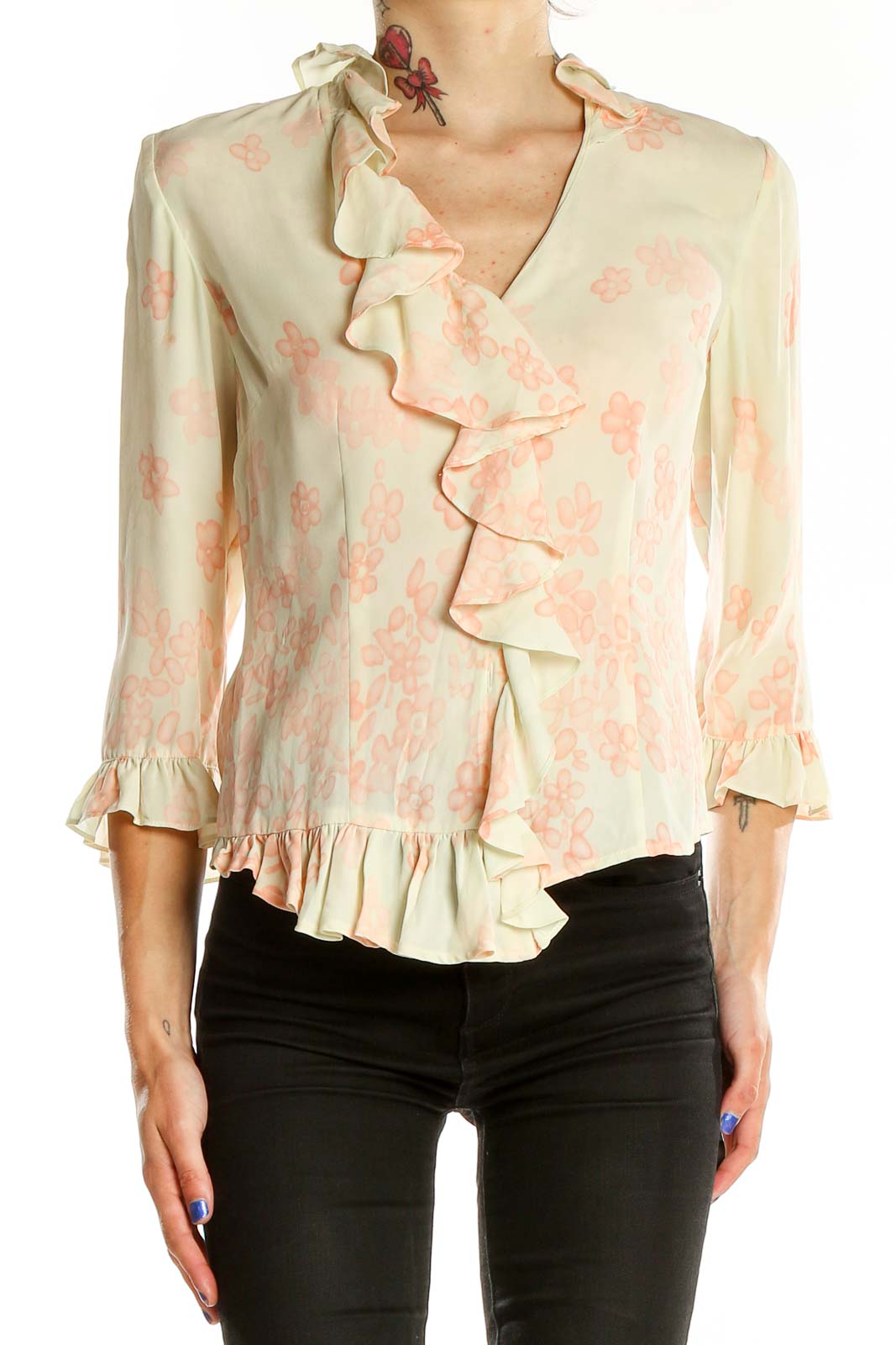 Front view of cream DonCaster blouse with peach floral print and ruffled V-neckline