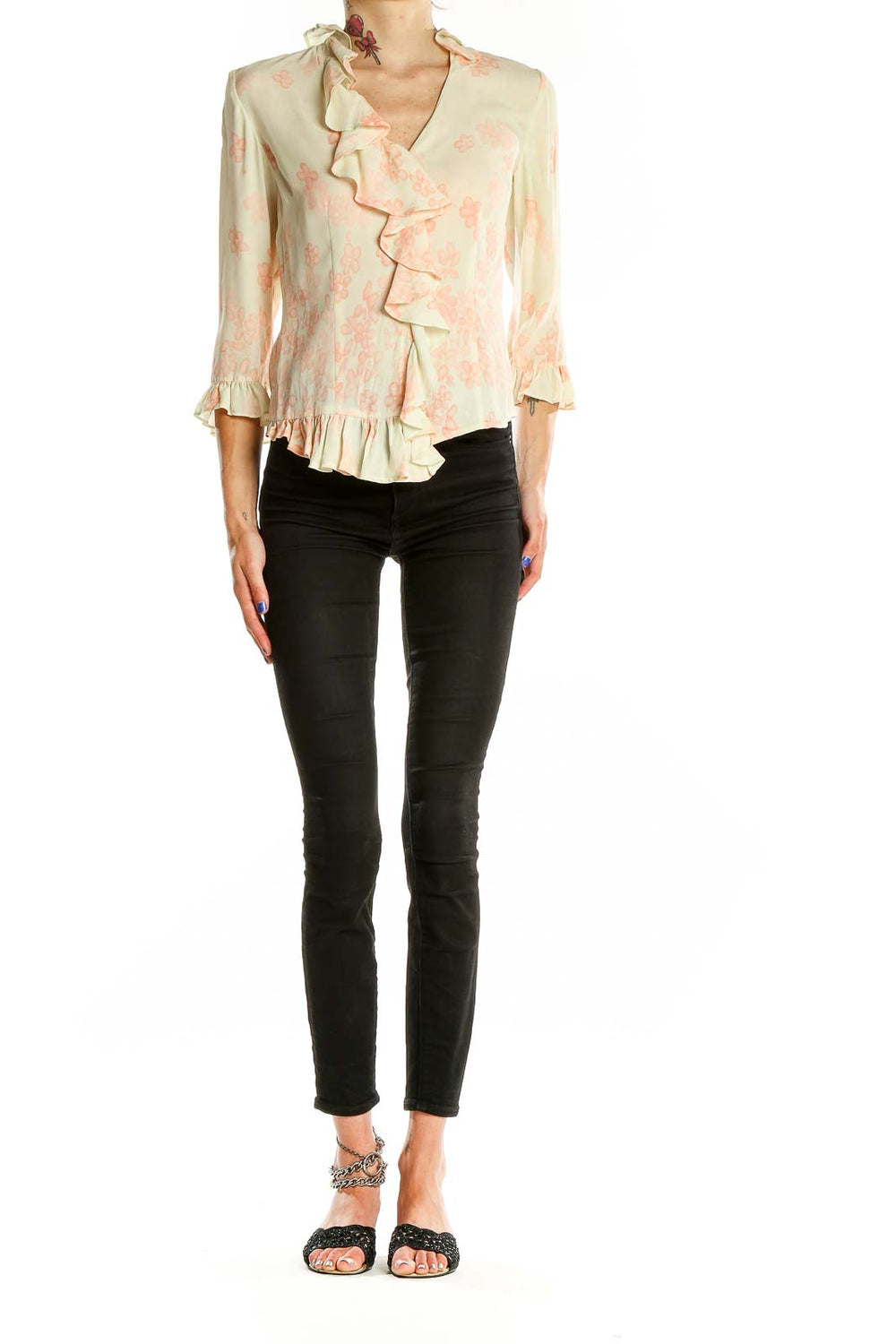 Front view of cream DonCaster blouse with peach floral print and ruffled V-neckline