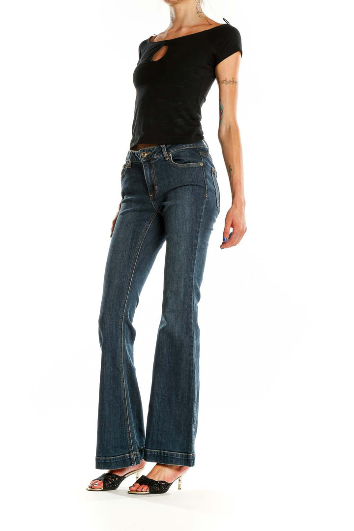 Front view of Cache blue flared denim jeans on model