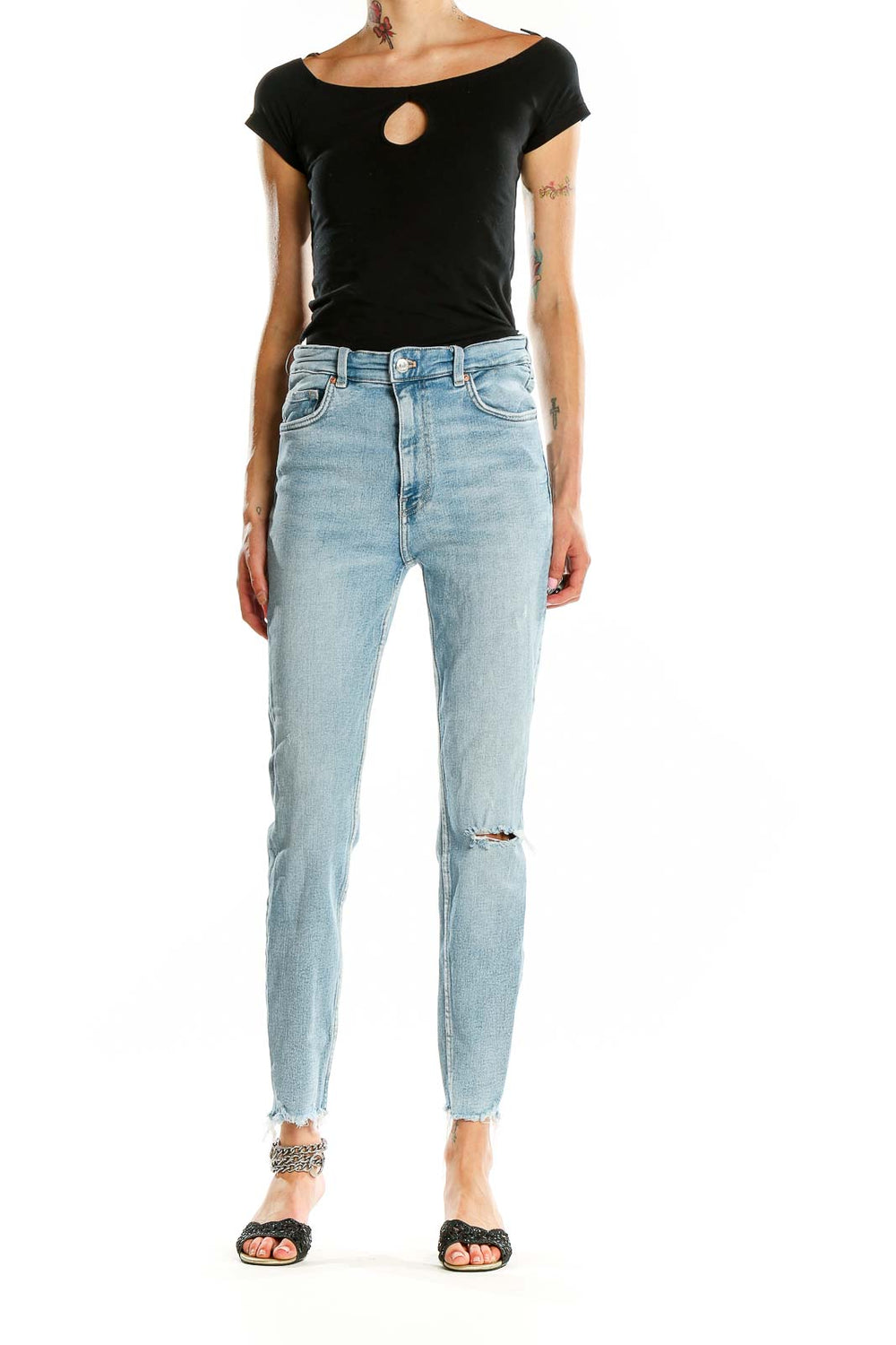 Front view of Zara light blue high-waisted skinny jeans with distressed knee