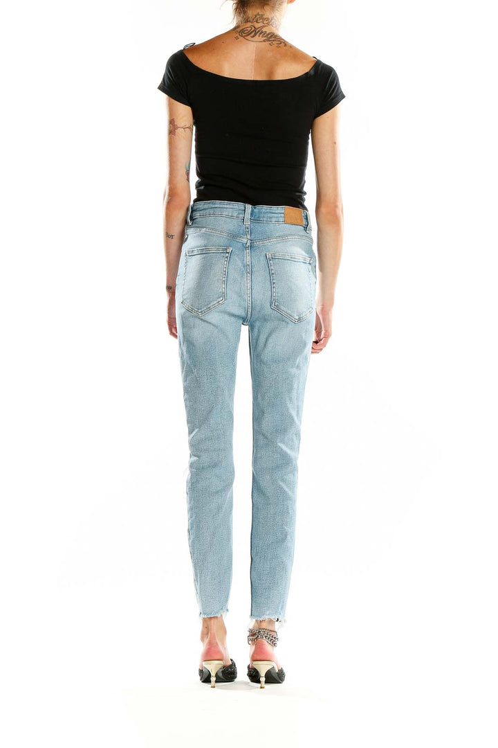 Back view of Zara light blue high-waisted skinny jeans showing pocket design