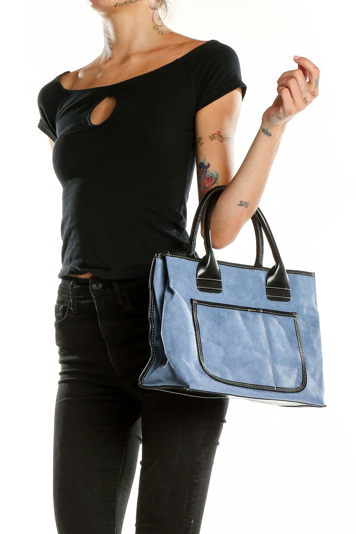 Front view of blue suede satchel with black leather handles by Signature Sax Fifth Avenue