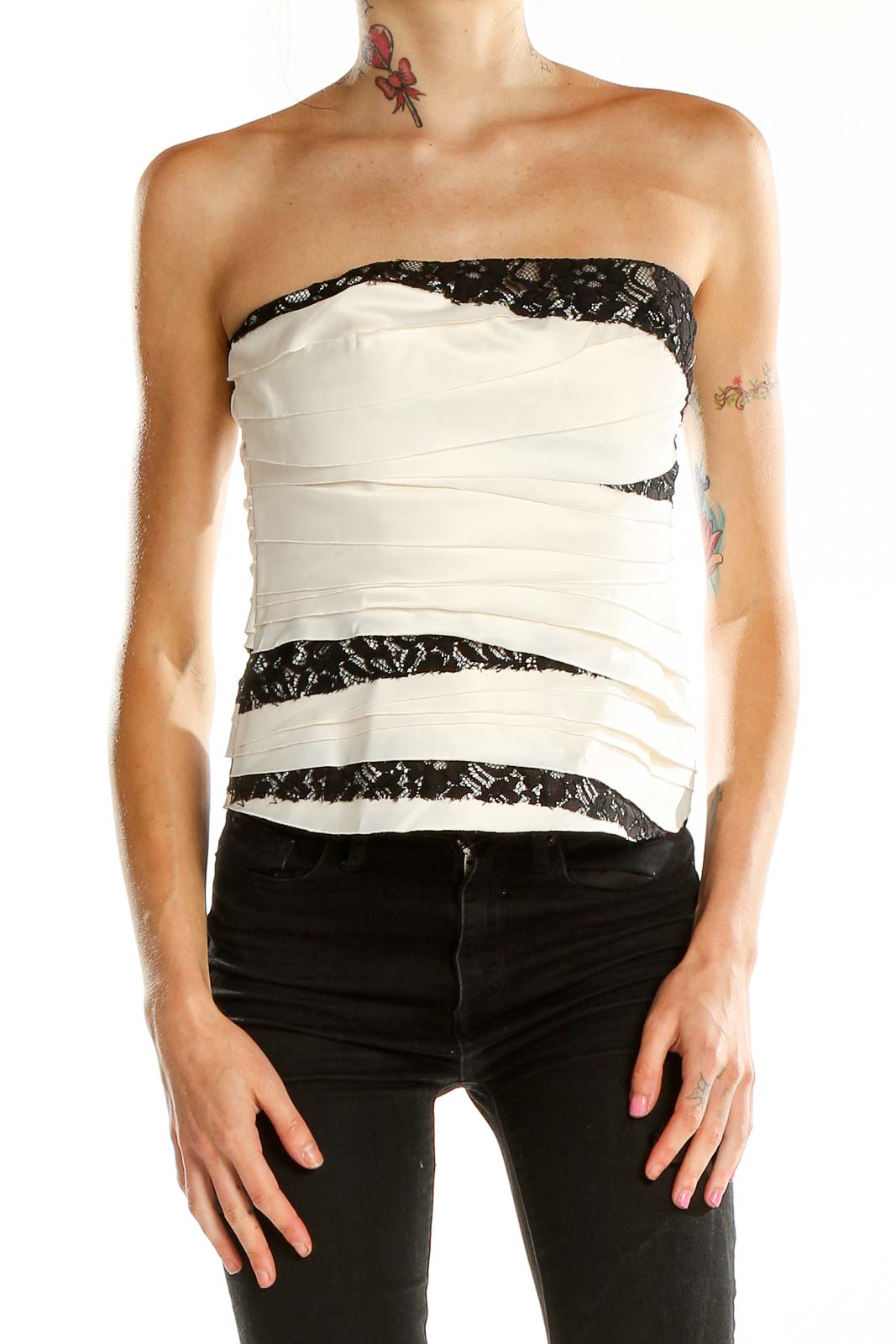 Front view of Bebe White Lace-Trimmed Strapless Crop Top with black lace accents