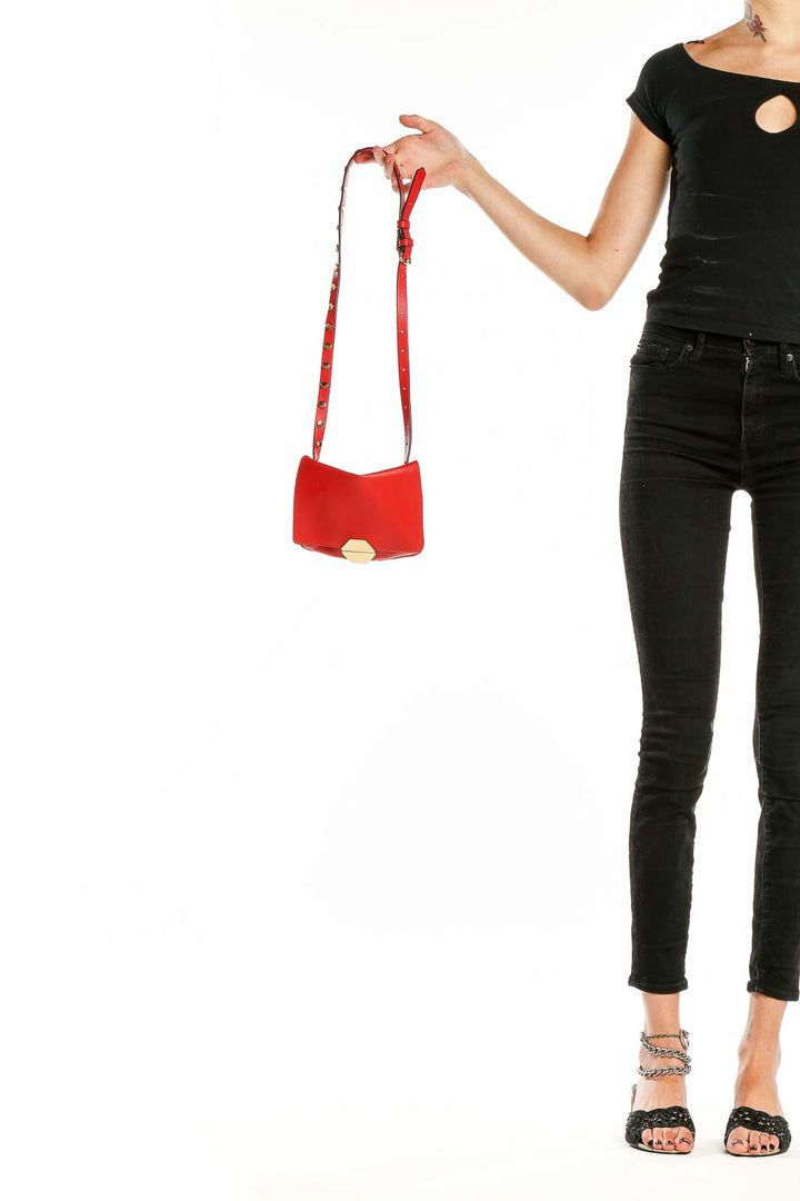 Front view of red Zara crossbody bag with gold clasp