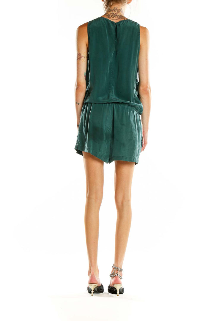 Back view of Boden green silk romper showing relaxed fit and sleeveless design