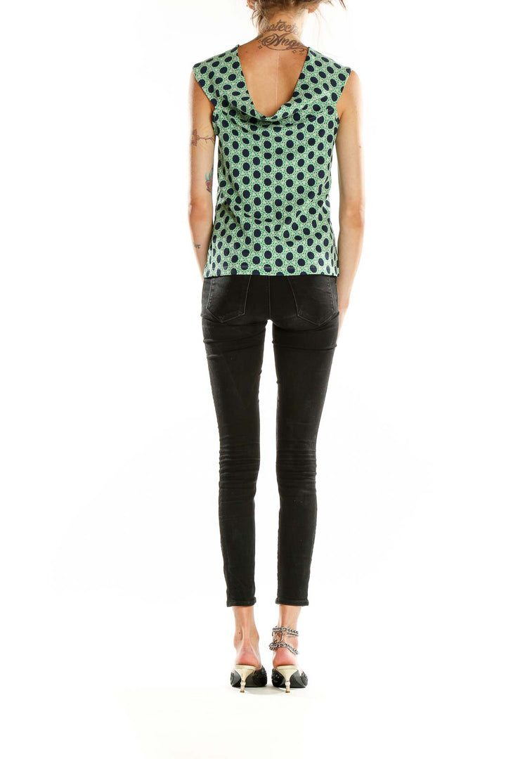 Back view of Maeve green polka dot sleeveless top showing v-neckline