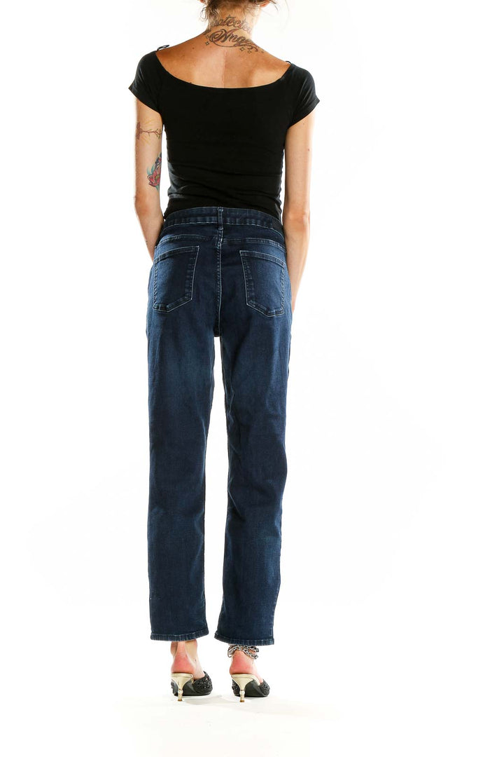 Back view of Calvin Klein dark blue relaxed fit jeans on model