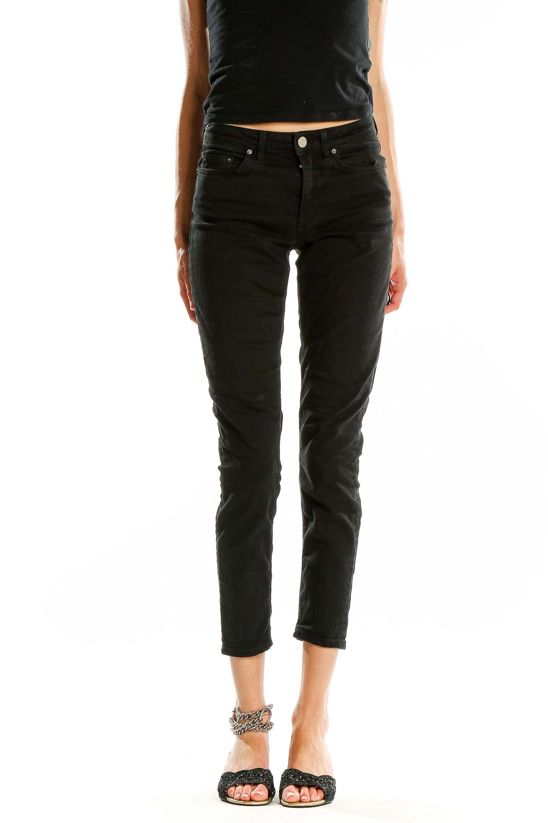 Front view of Acne black slim-fit cropped jeans on model